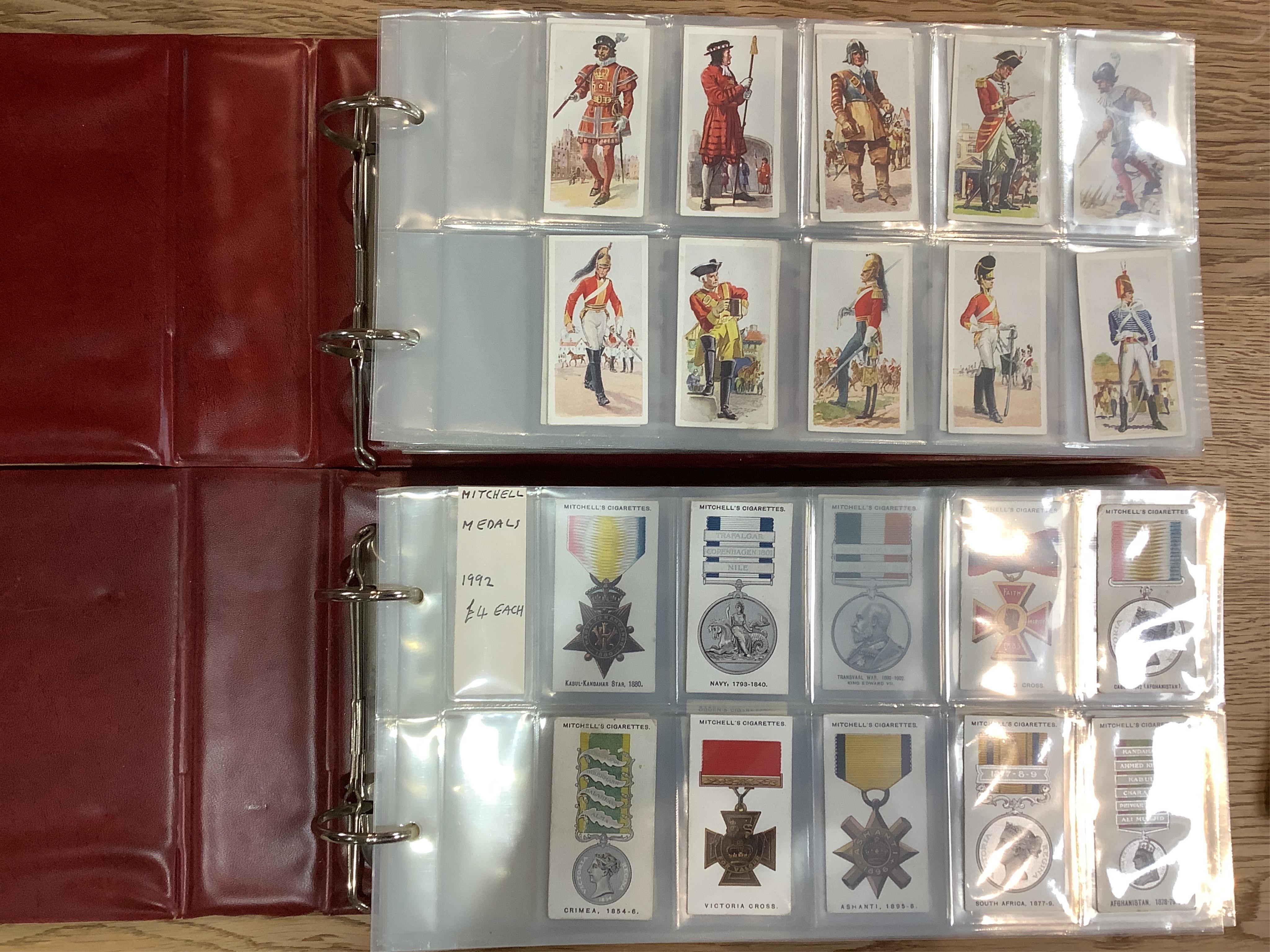 Six albums of assorted cigarette cards; Military Uniform, Medals, Heroes, Magic tricks and Coins. Condition - overall good